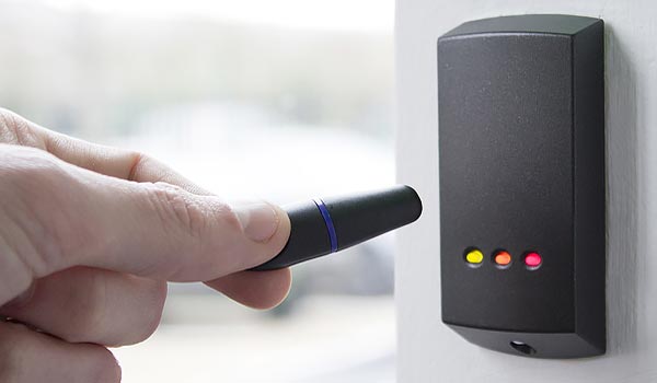Hand Holding Fob To Open Access Control Systems For Fire Safety