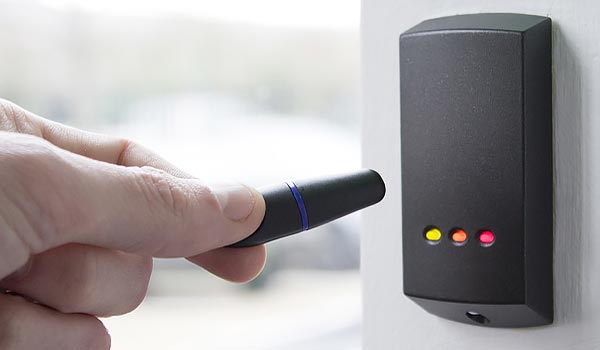 Using Fob For Access Control Systems Hand Holding Fob To Open Access Control Systems For Fire Safety